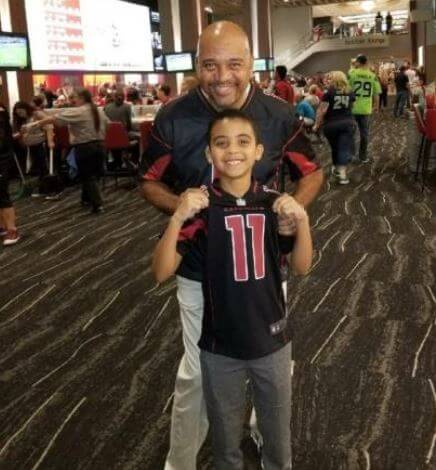 Donald Wilbon brother Michael Wilbon with his son Matthew at State Farm Stadium.